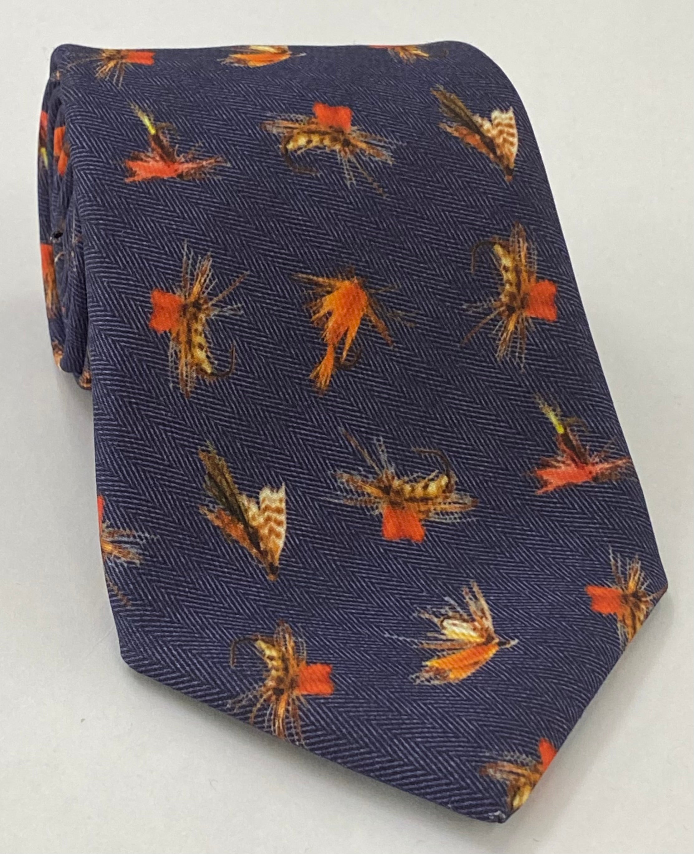 ミッドナイトブルー地にバーントオレンジ、オフホワイト、ブラウンのマクルスフィールドプリント(ルアー柄)ウールネクタイ MCWT-2