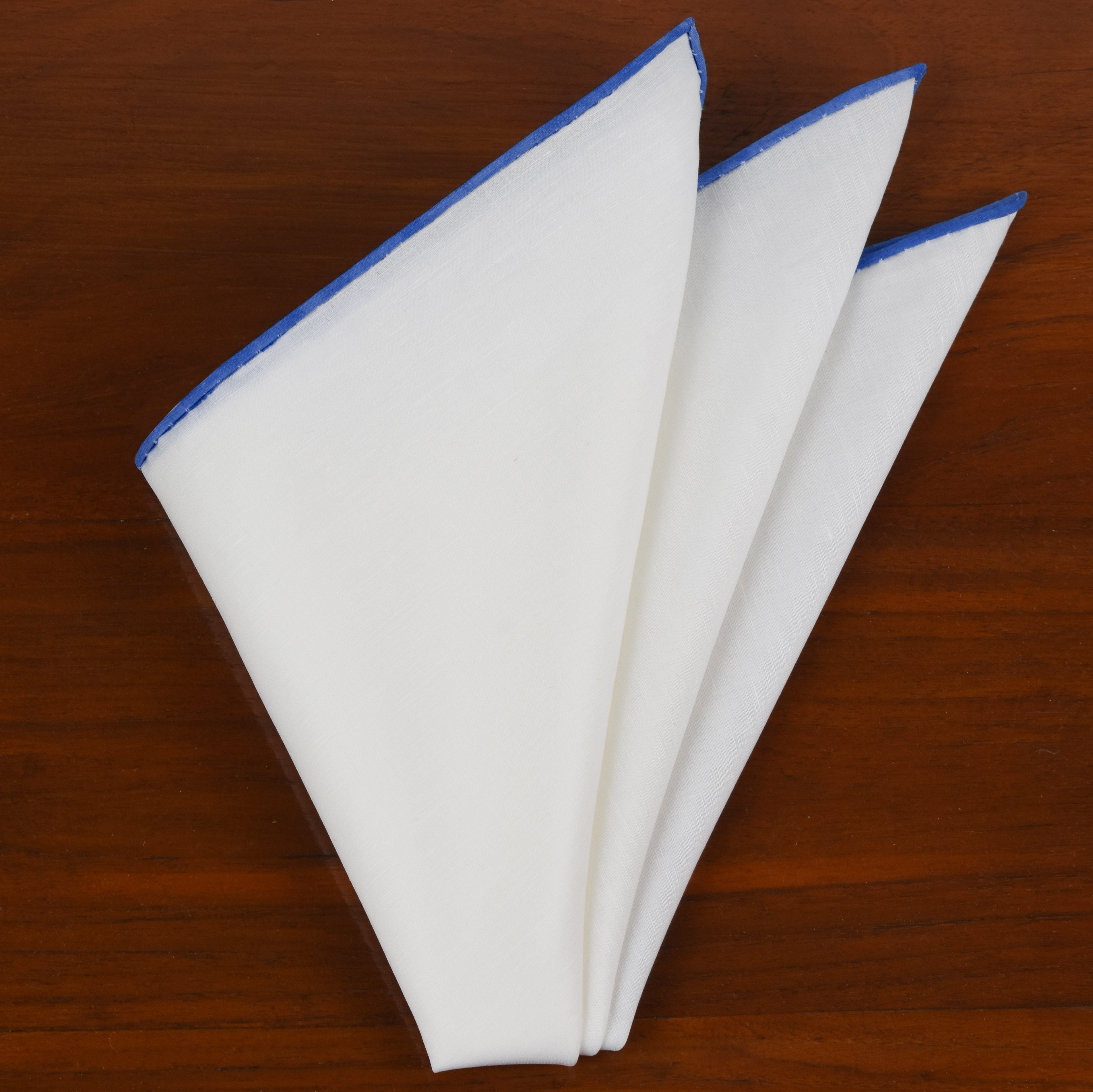 {[en]:Natural White Linen/Cotton With Sky Blue Contrast Edges Pocket Square