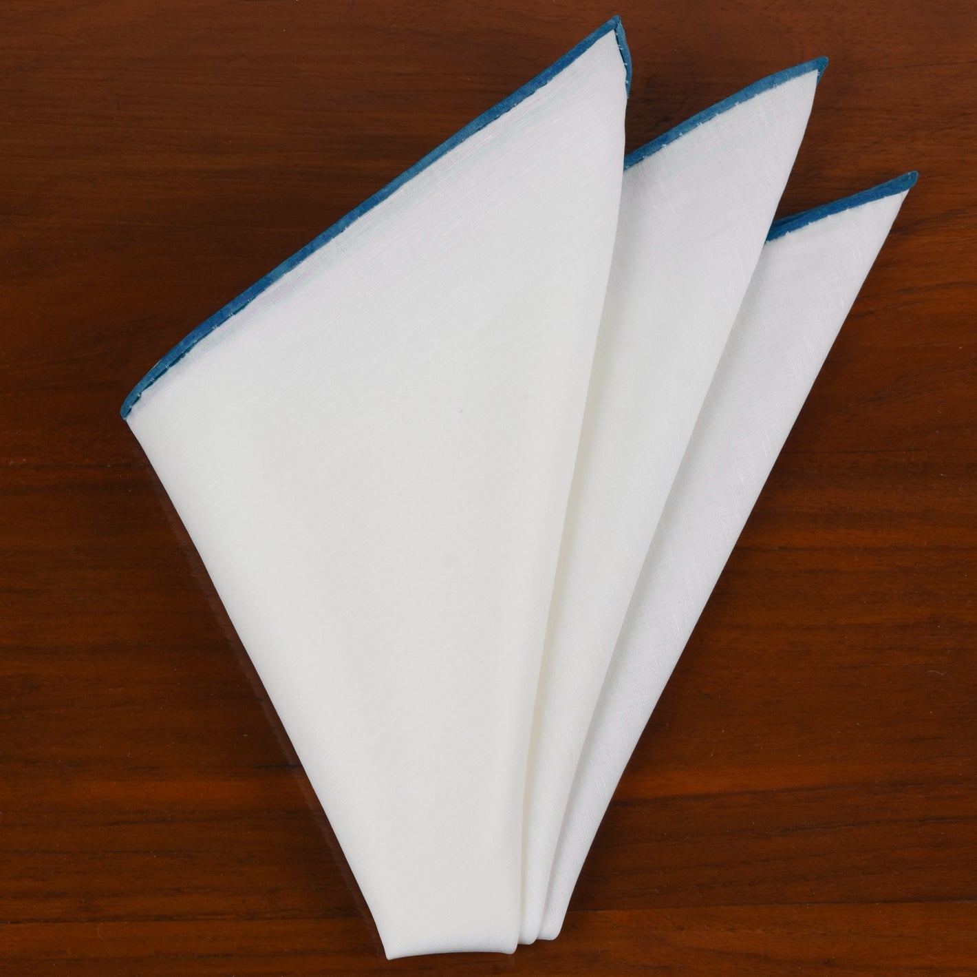 {[en]:Natural White Linen/Cotton With Dark Turqouise Contrast Edges Pocket Square