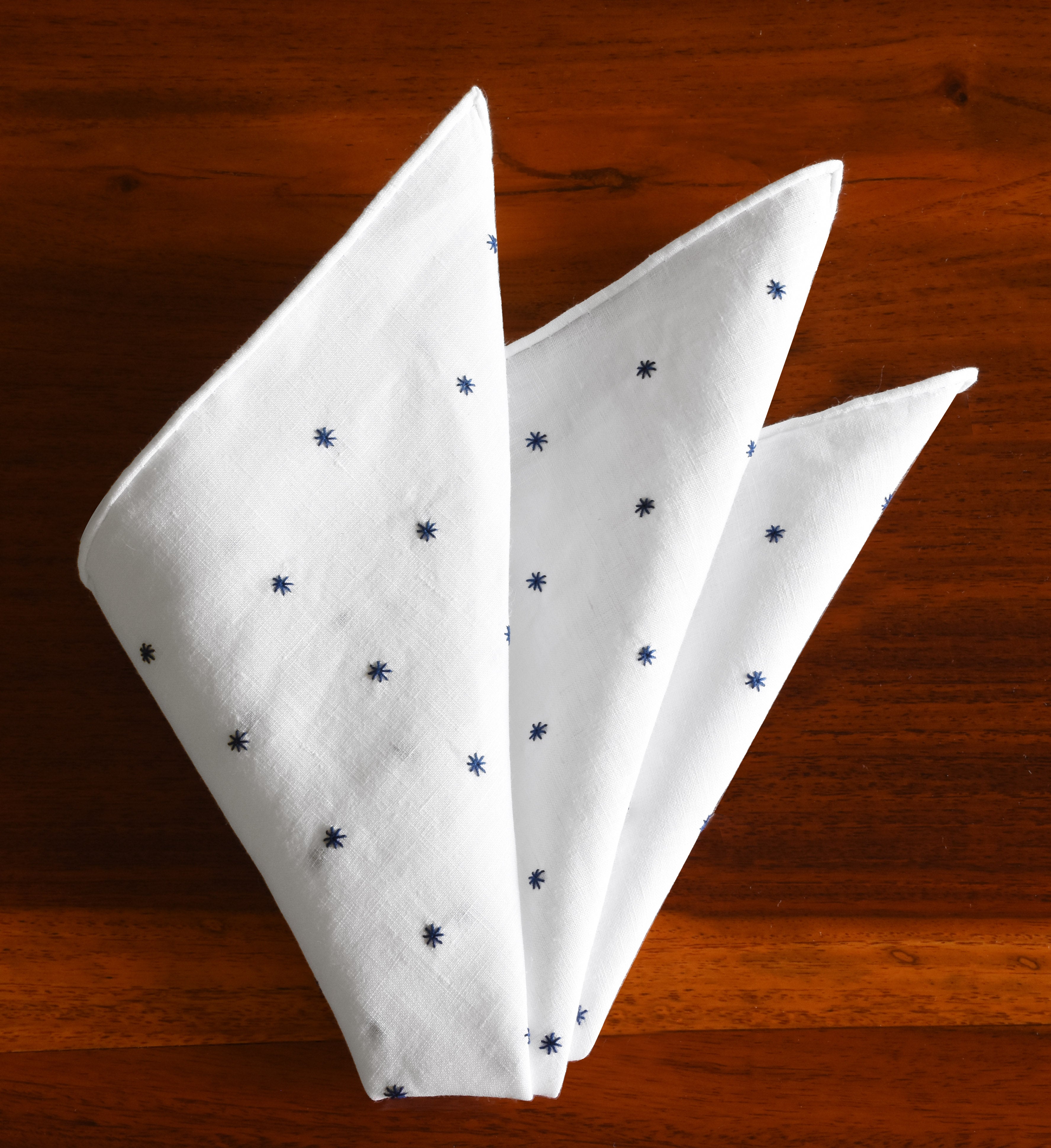 {[en]:Belgian White Linen With Dark Navy Blue Embroidered Stars Pocket Square
