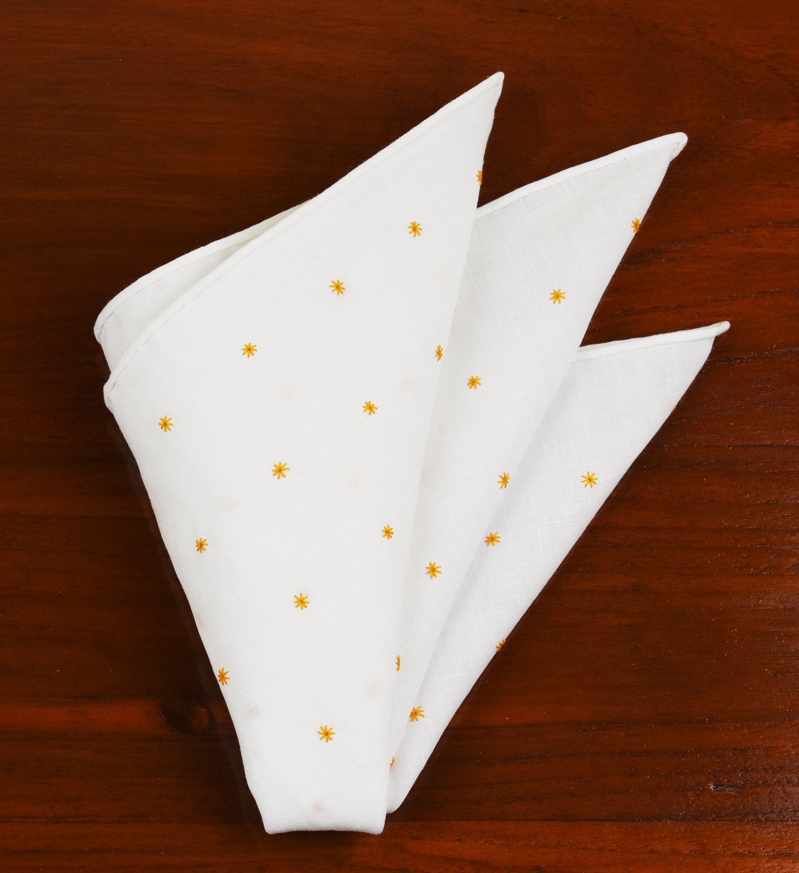 {[en]:Belgian White Linen With Orange Embroidered Stars Pocket Square